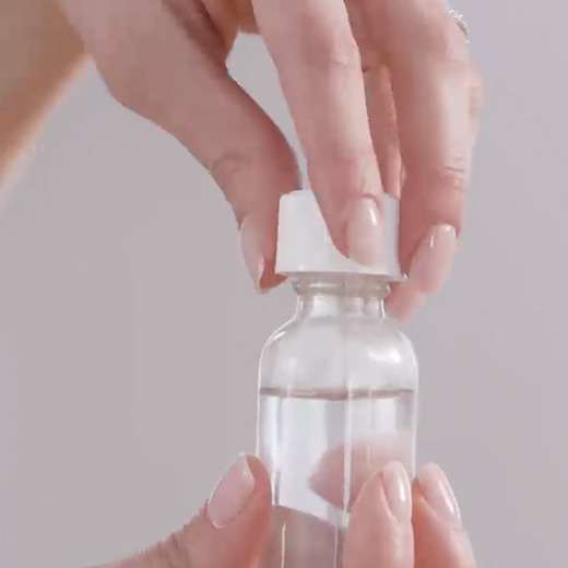RAVICTI bottle with childproof cap being opened.